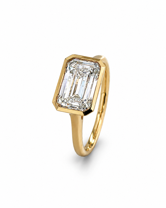 Emerald Cut Bezel Diamond Ring in Yellow Gold